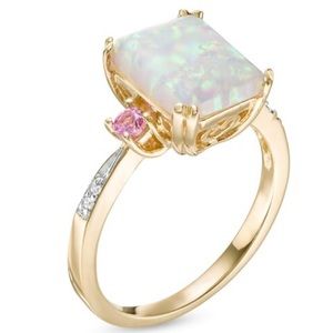 Fashioned in 10K gold, this three stone ring